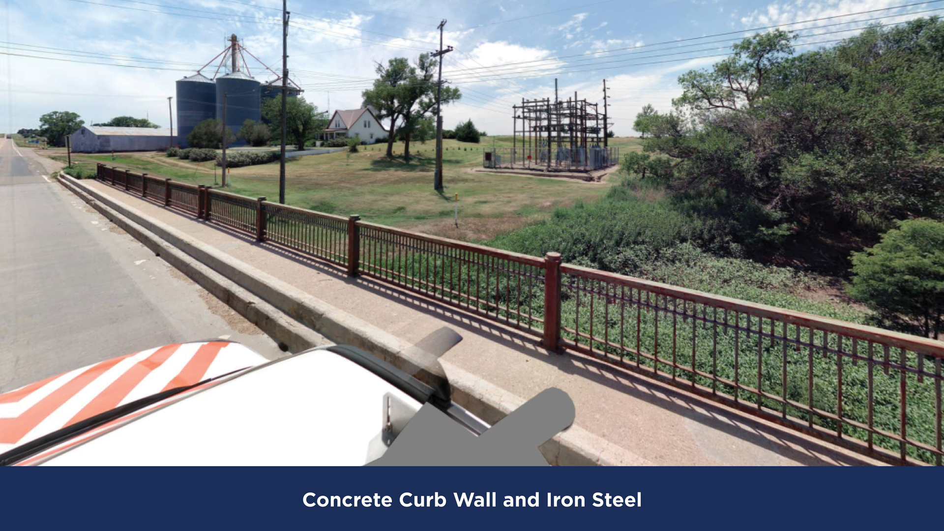 KDOT Bridge and Culvert Railing example showing concrete curb wall and iron steel